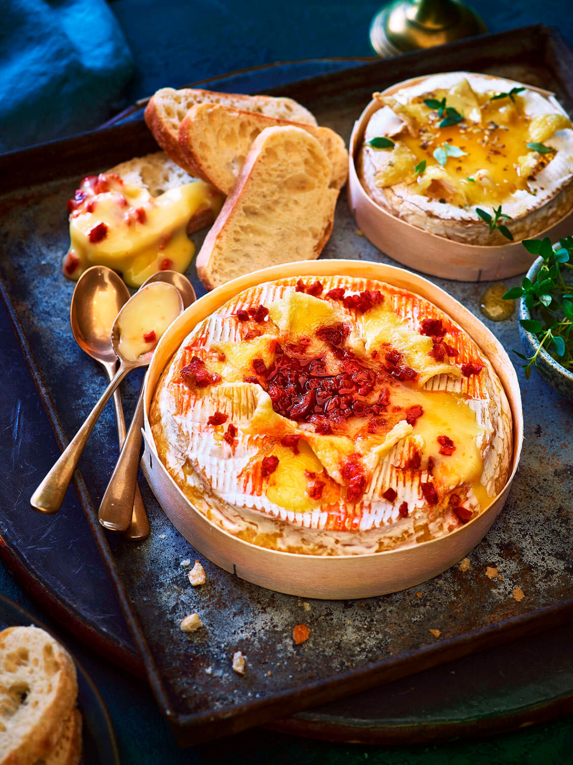 Melted baked Camembert with a bacon and sweet tomato topping  served with crusty bread to share and dip