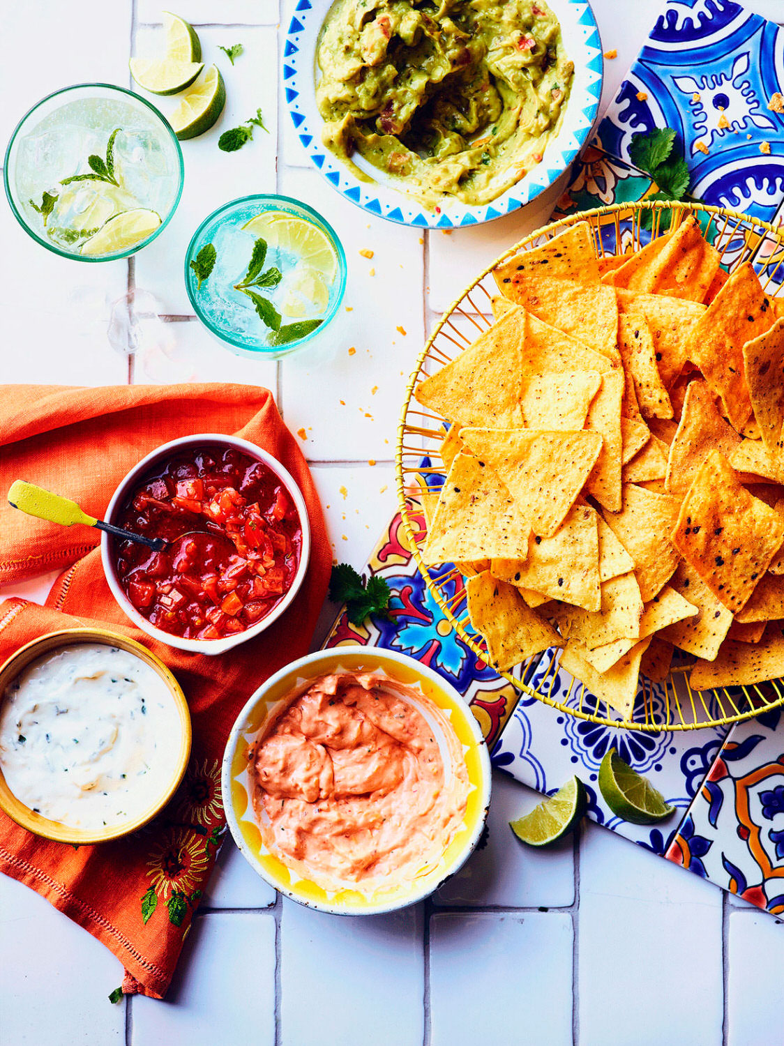 Lidl Moments Front Cover Tortilla chips served with salsa and tex mex dips. 