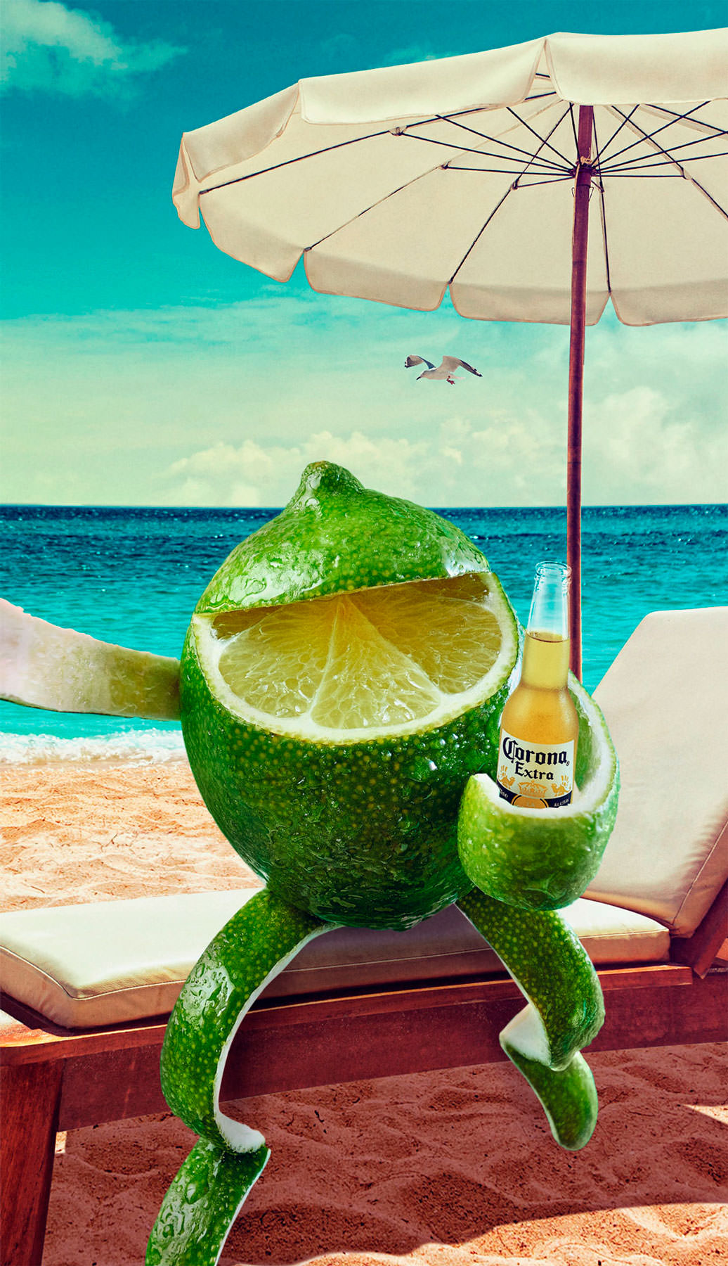 A lime made to look like a man or woman taking a drink of corona beer whilst taking a selfie sat on a sun lounger on the beach - London Food & Drinks Photographer