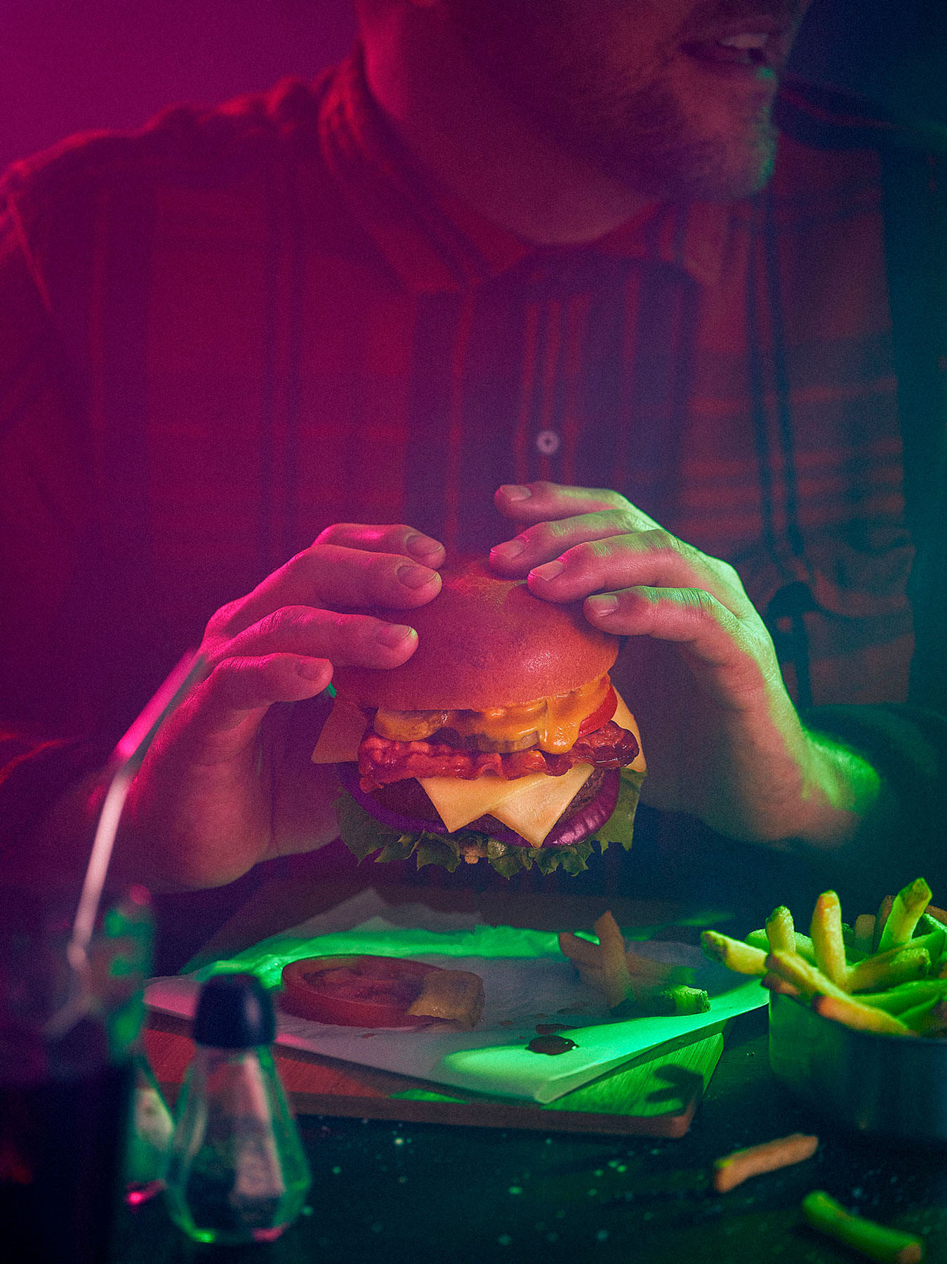 burger being eaten in late night bar - London Food & Drinks Photographer