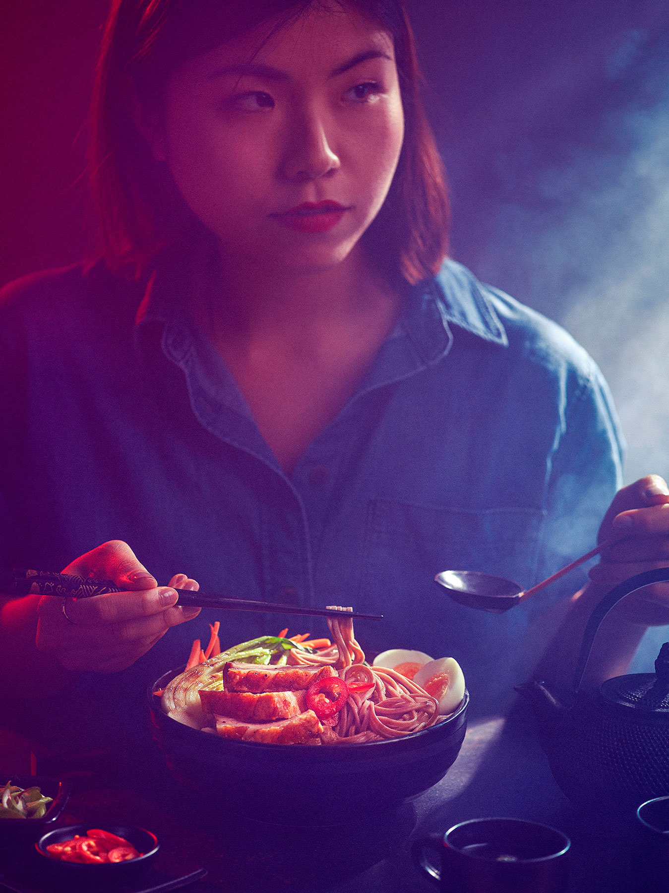Ramen being eaten by Japanese women in a late night cafe setting - London Food & Drinks Photographer