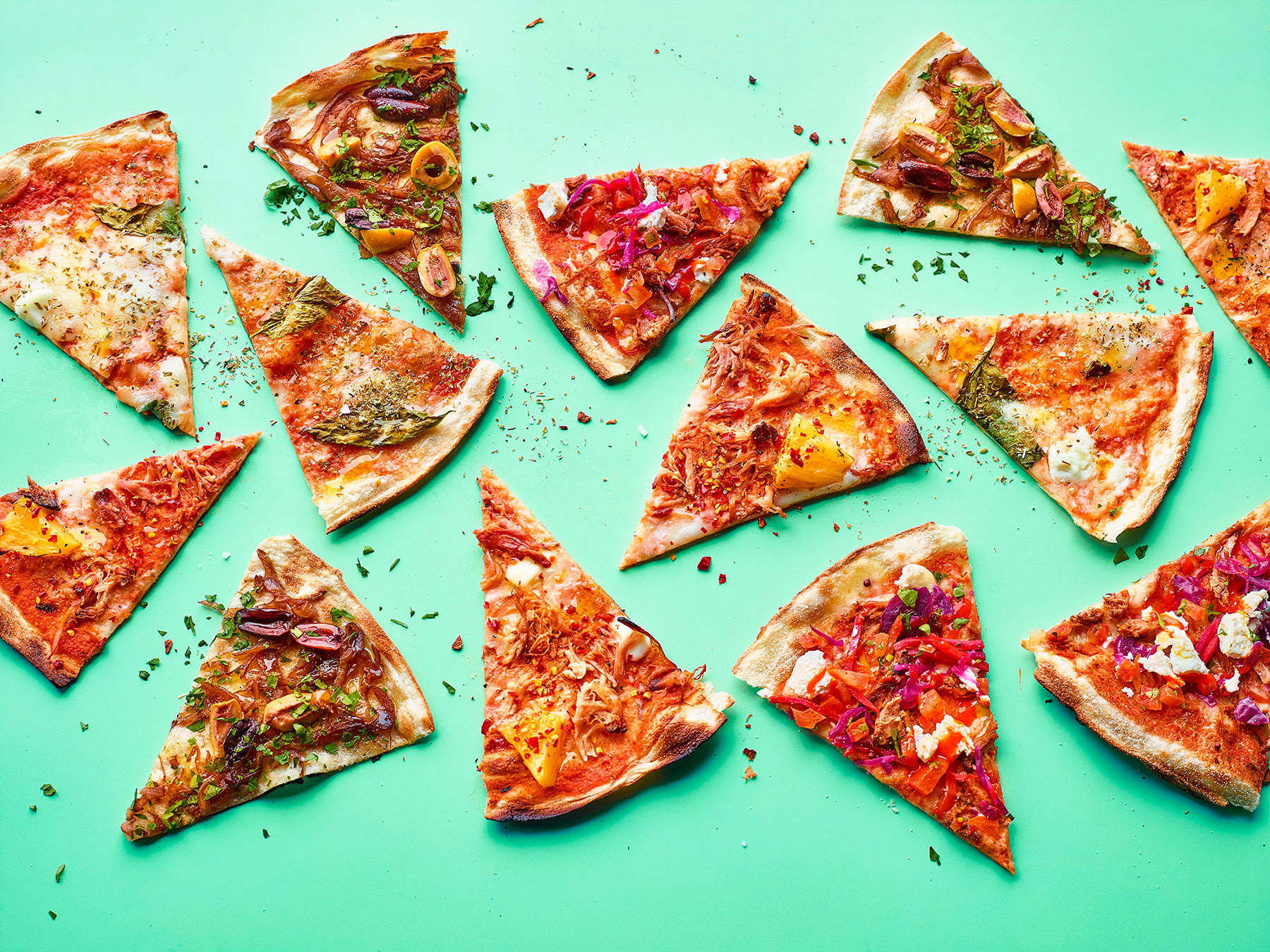Pizza slices arranged graphically on a vibrant green background - London Food & Drinks Photographer