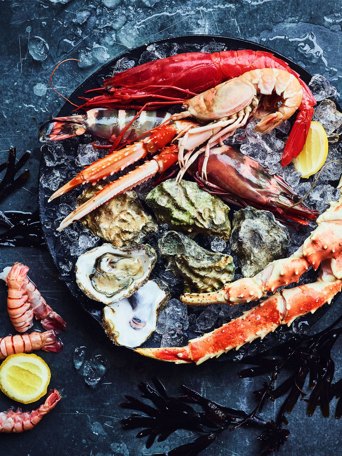Seafood platter containing king crab claws, oysters, and a variety of different prawns - London Food & Drinks Photographer