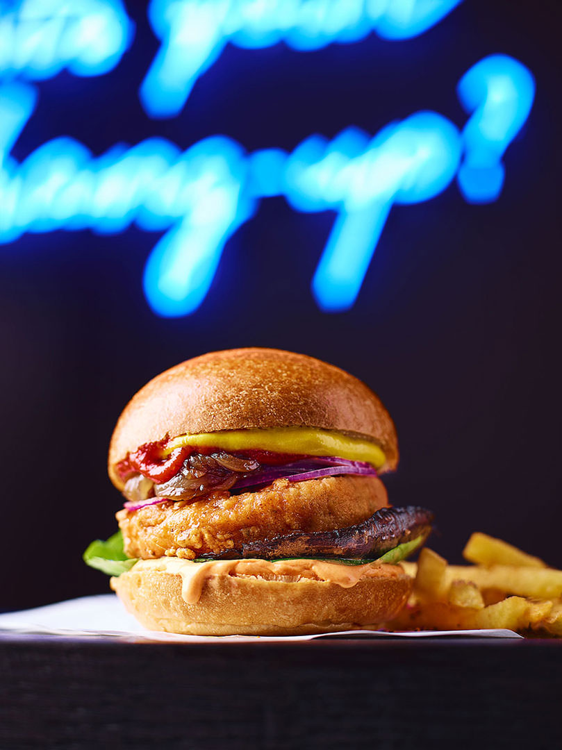 Vegan Burger on a neon backdrop