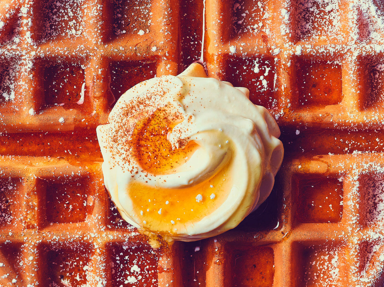 Waffle with spiral cream on top drizzled with maple syrup - London Food & Drinks Photographer